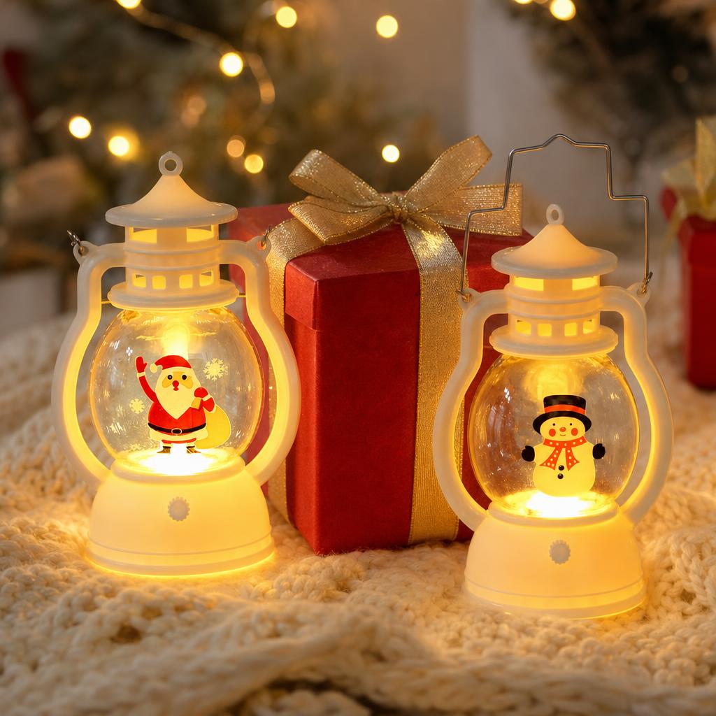 Two LED lanterns next to a Christmas gift